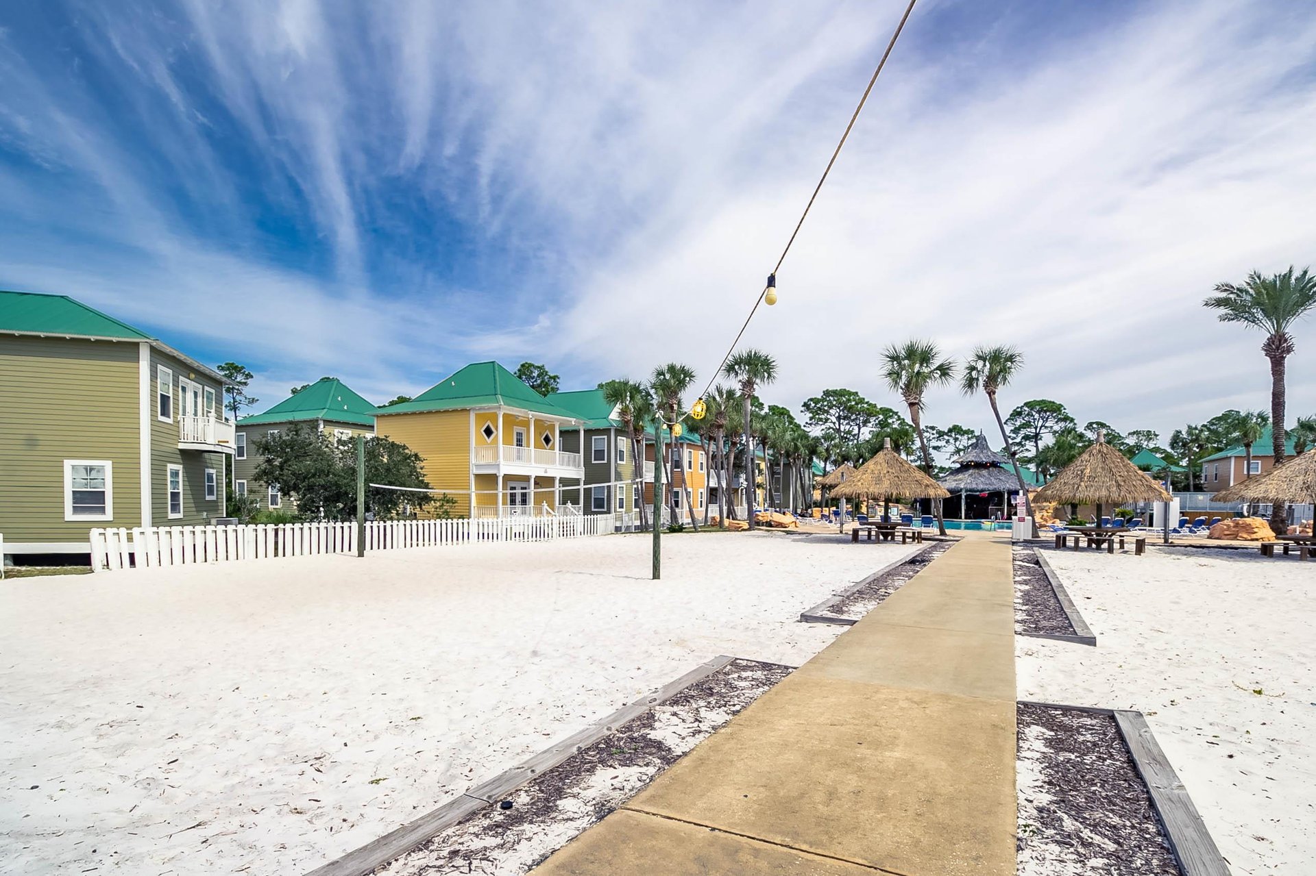Sand volleyball court just off the pool deck—fun for families and groups looking to stay active