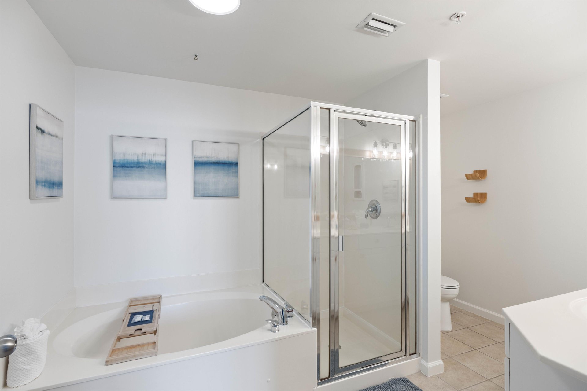 Garden tub and separate shower with double vanities.