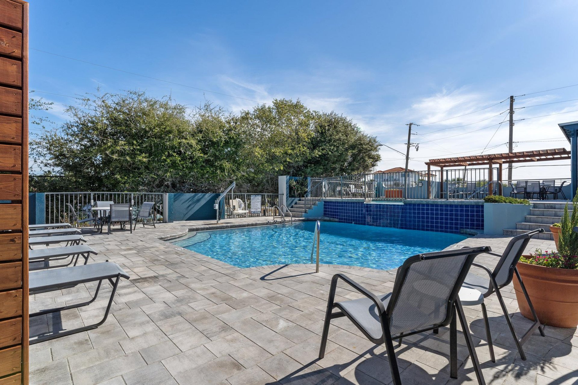 Spacious 1st level pool deck with peaceful water feature