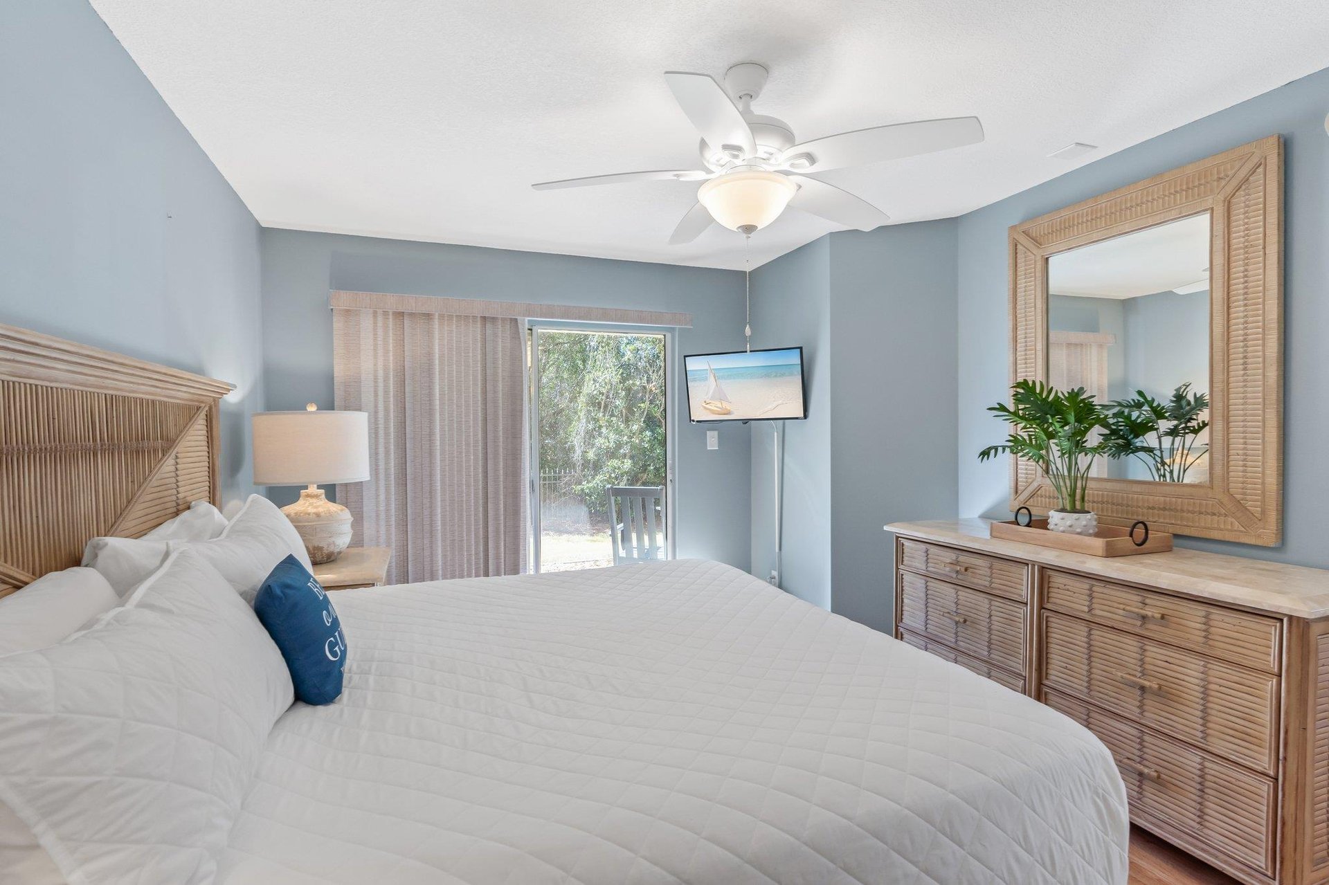 Primary Bedroom wit King Bed and Mounted TV