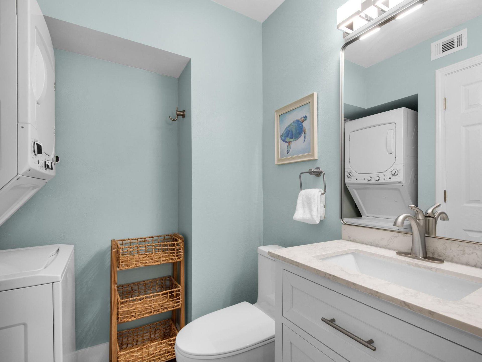 Half Bath off Primary Bedroom and Laundry Center