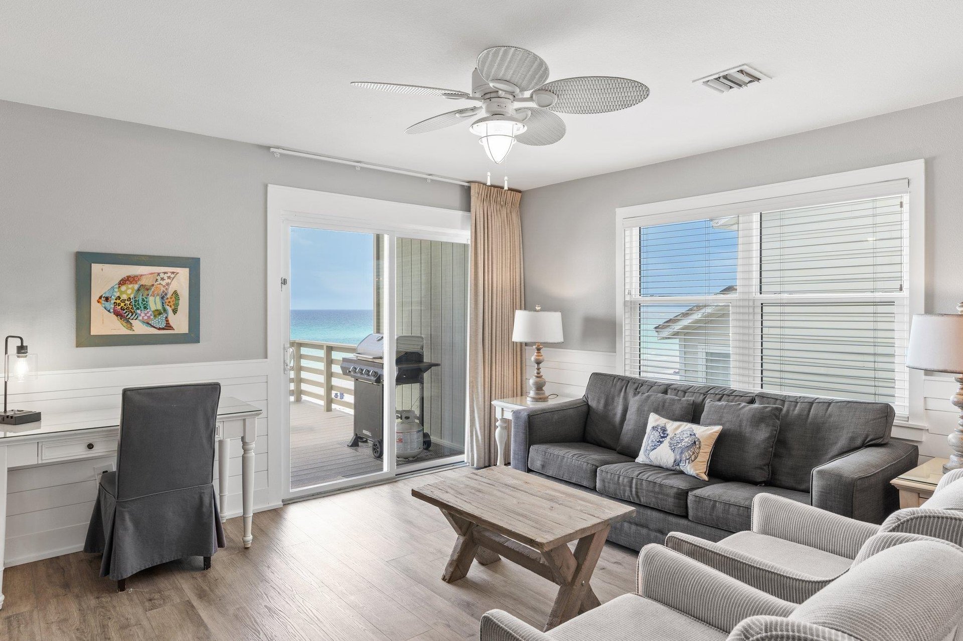 Desk and Living Area Opens to a Private Deck