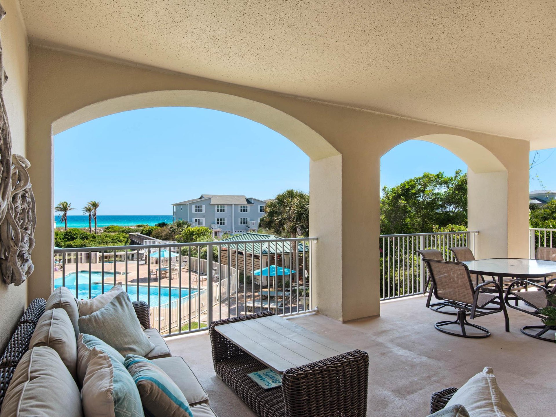 Balcony seating with pool and Gulf view