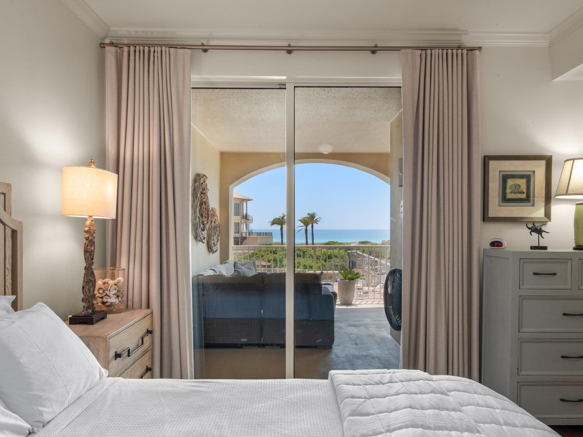 Primary bedroom with balcony access and Gulf view