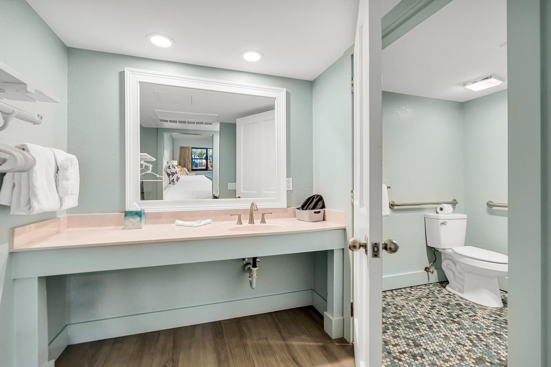 Bathroom vanity counter with large mirror
