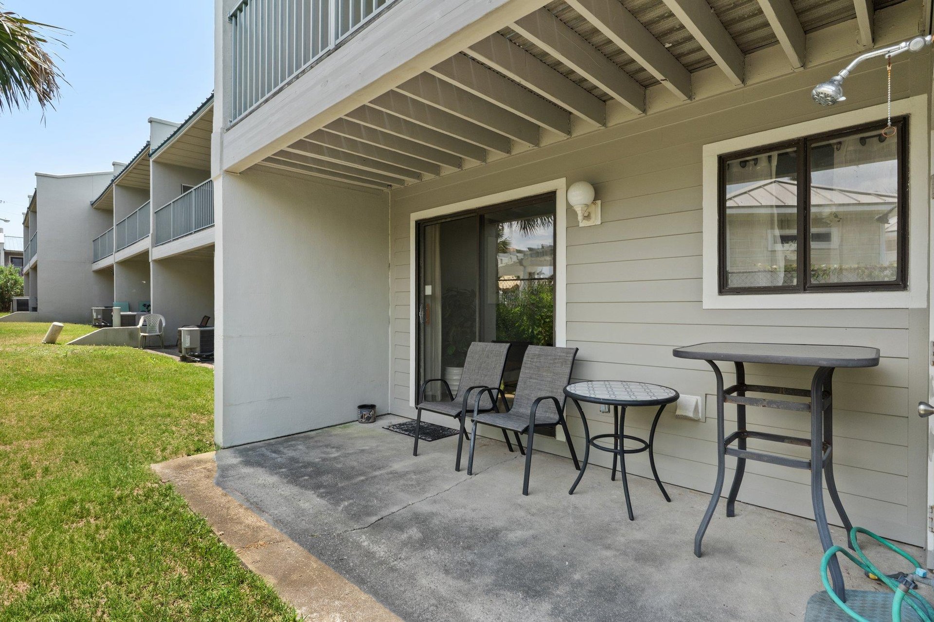 Back Porch with Patio Furniture and Outdoor Shower on 1st Floor