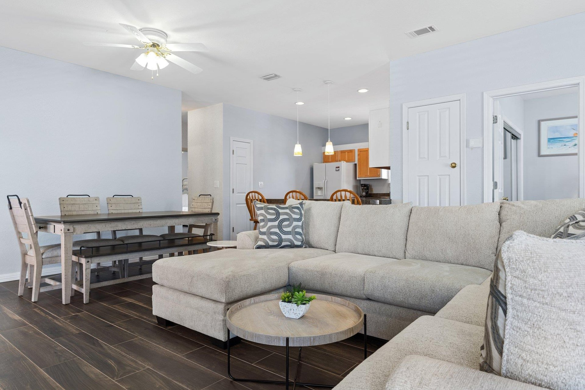 Living Room open to Dining and Kitchen