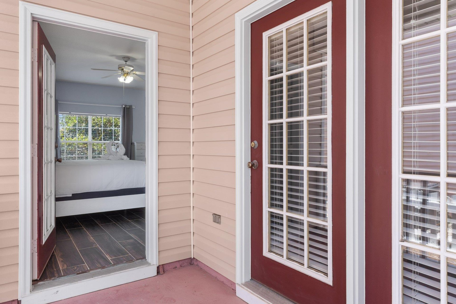 Primary Bedroom with King Bed leading to Front Porch