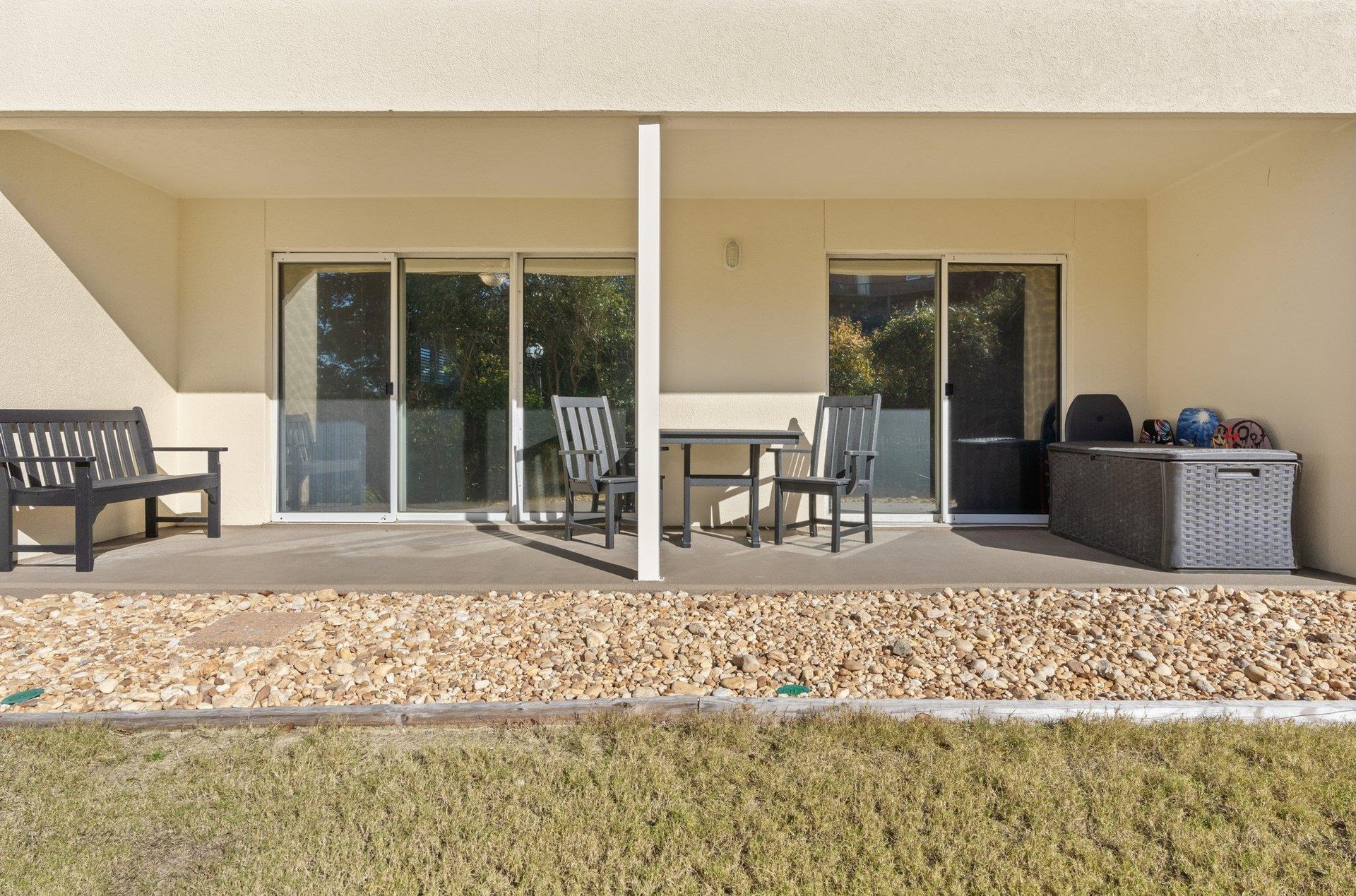 Large Patio Seating with Access from Primary Bedroom and Living Room  this grassy area is not a pet friendly area