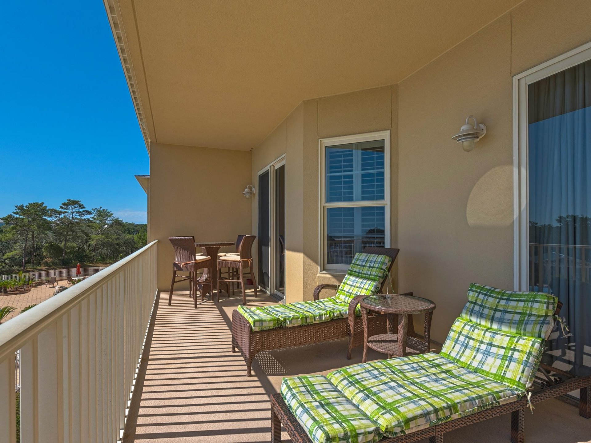 Large private balcony with comfortable furniture