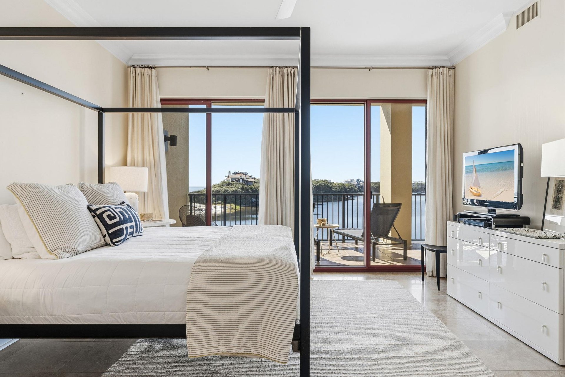 Bedroom 1 with King Bed and Private Balcony Access