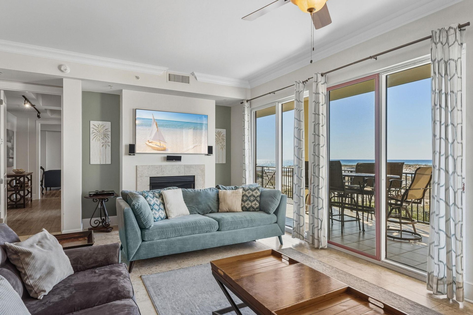 Living Room with Fireplace and Private Balcony Access