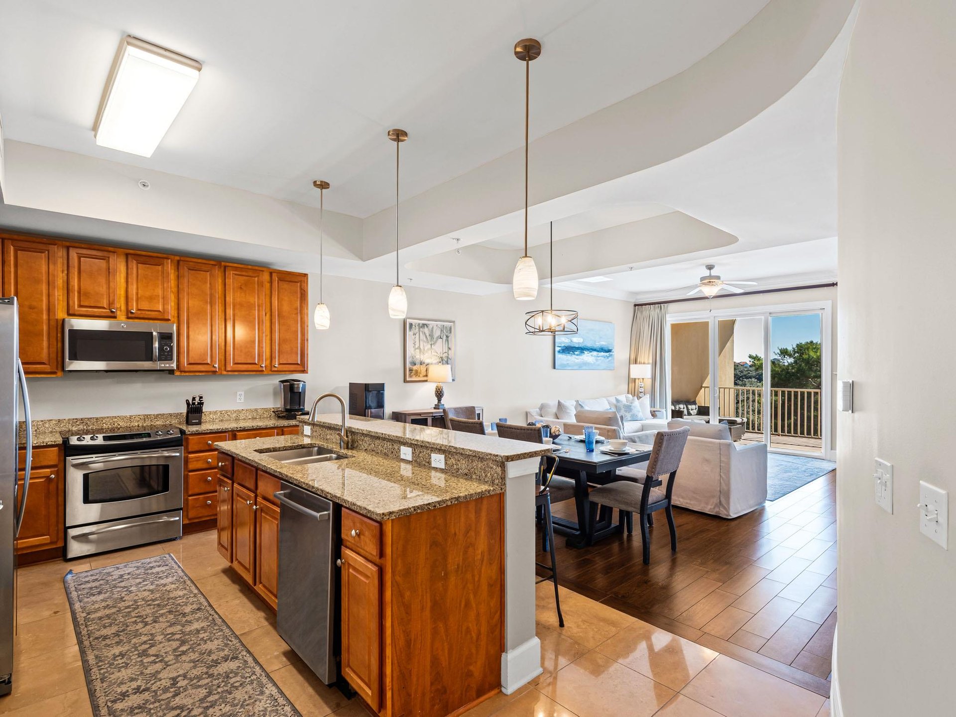 Kitchen flows seamlessly into the dining and living areas, creating the perfect space for memorable gatherings and relaxing evenings.