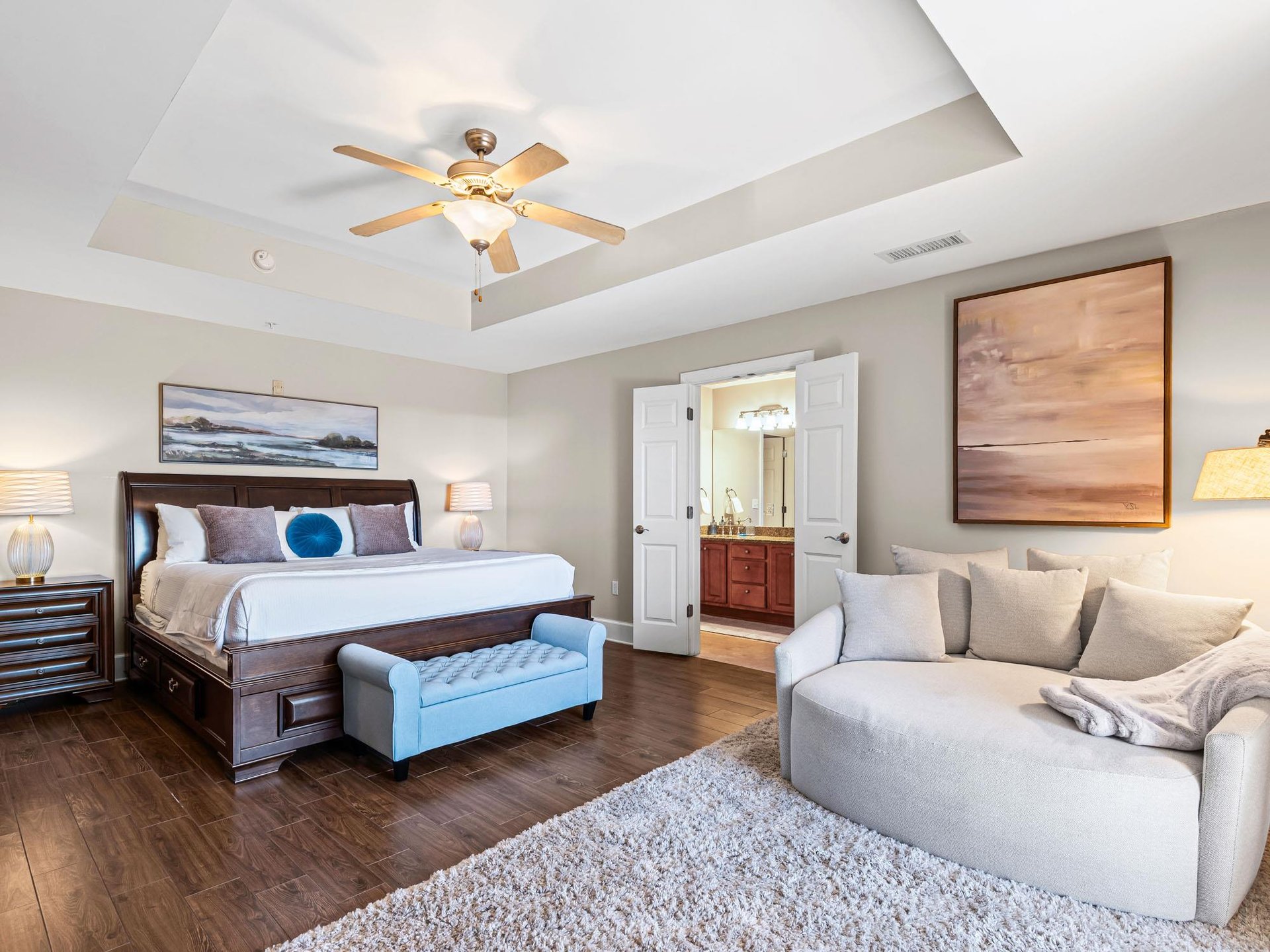 Unwind in your private suite featuring a plush king bed and cozy seating area for ultimate relaxation.