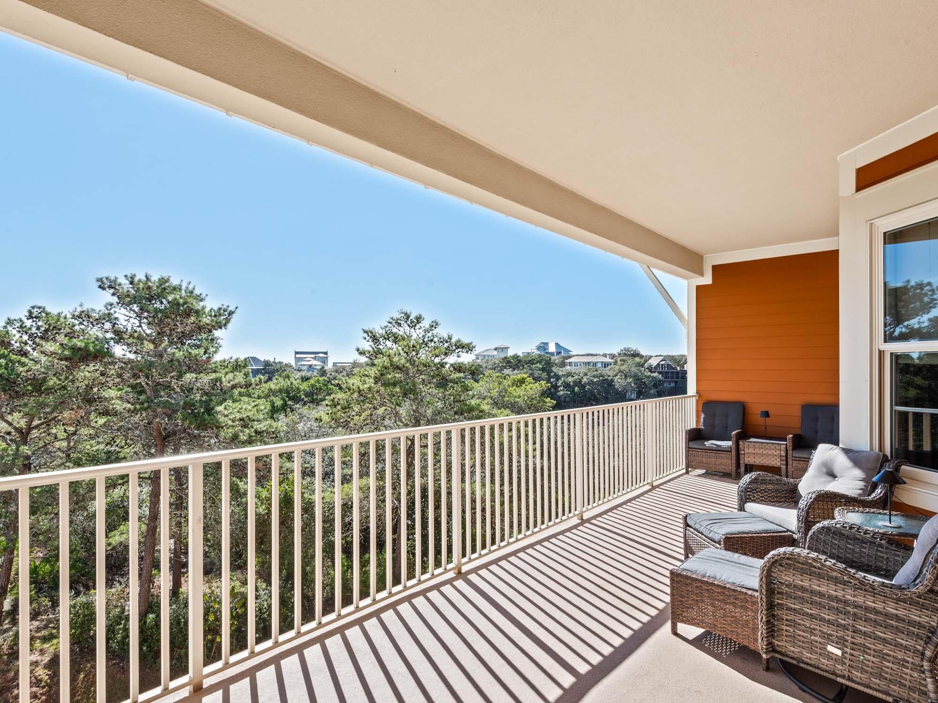 Unwind on your private balcony with comfortable seating, perfect for morning coffee or evening relaxation while enjoying treetop views.