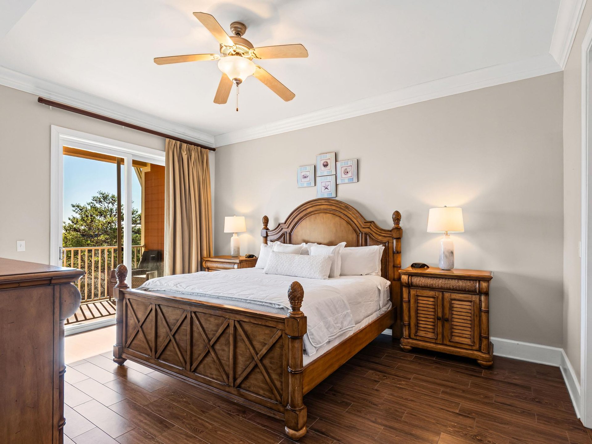 Bedroom 2 king bed and rich wood furnishings, crisp linens, and balcony.
