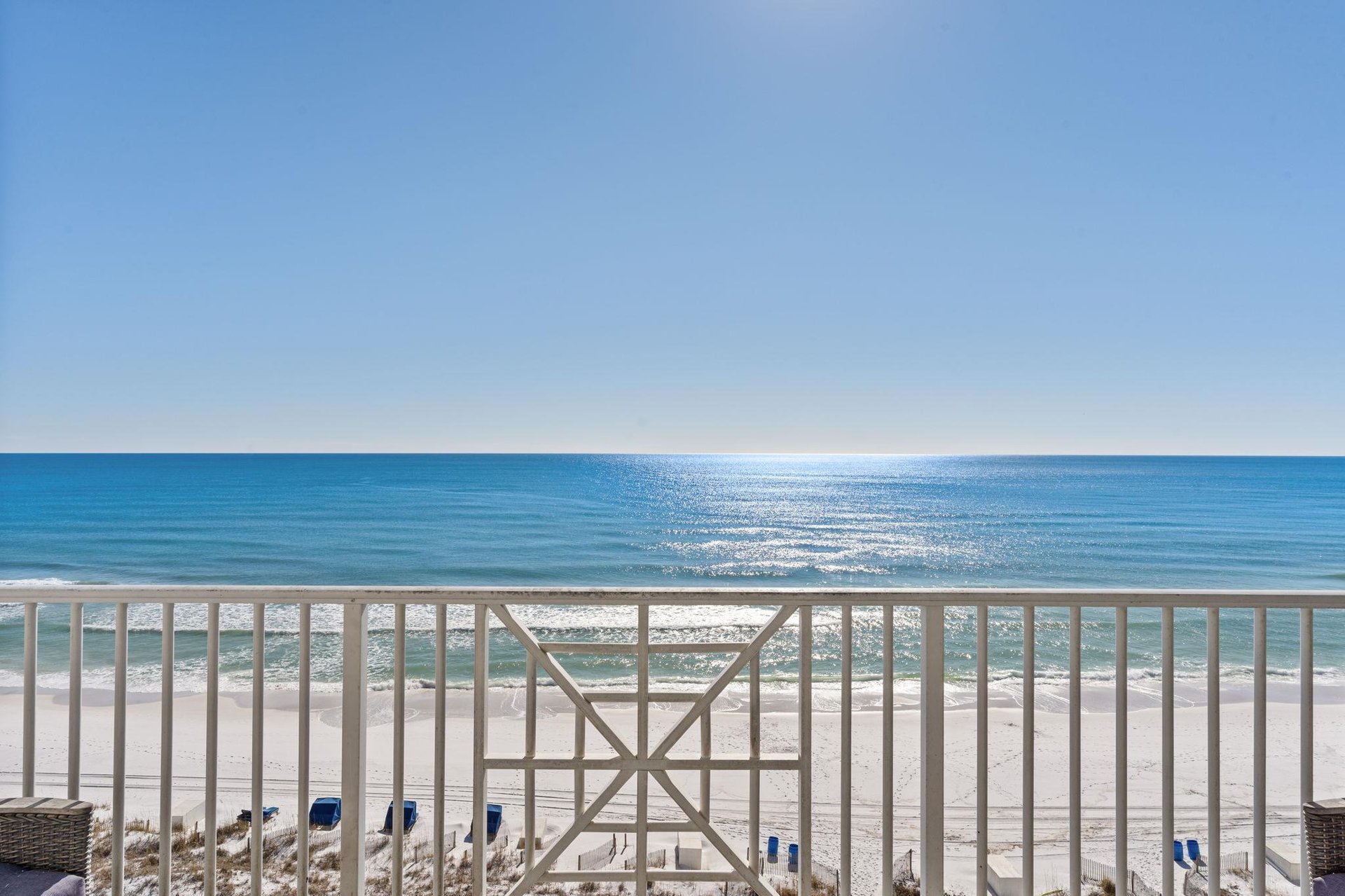 Wake up to endless emerald waters and pristine white sand stretching beyond your private balcony railing.