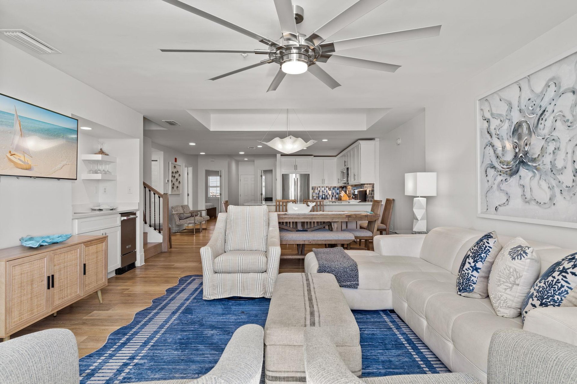 Relax in your spacious openconcept living area with coastalinspired decor, modern amenities, and flowing spaces perfect for gathering.