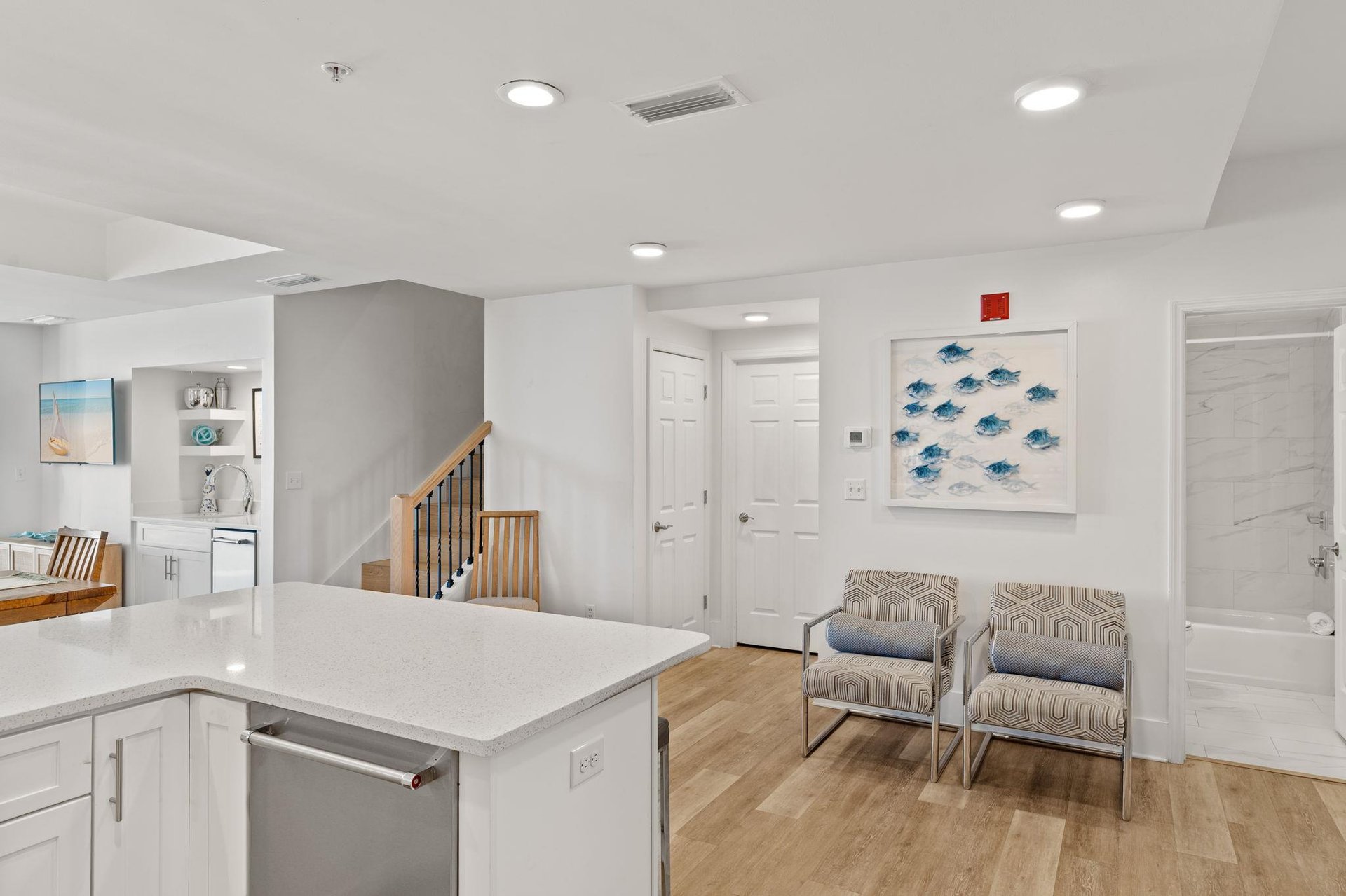 Relax in your bright, modern living space with stylish seating and a fully equipped kitchen island perfect for casual dining.