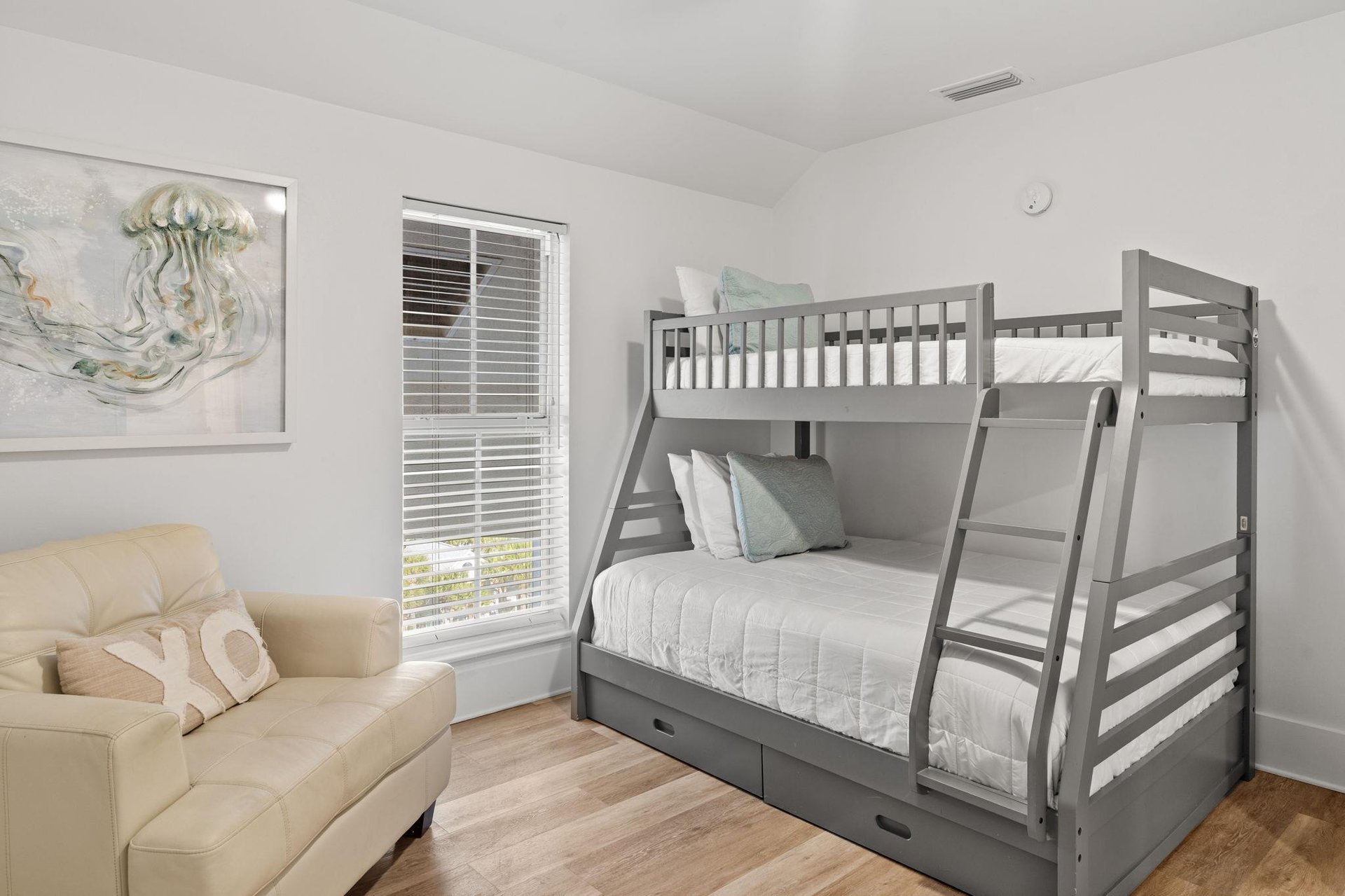 Drift off to sleep in this cozy room featuring a spacious twin over full  bunk bed and comfortable seating area for your familys perfect retreat.