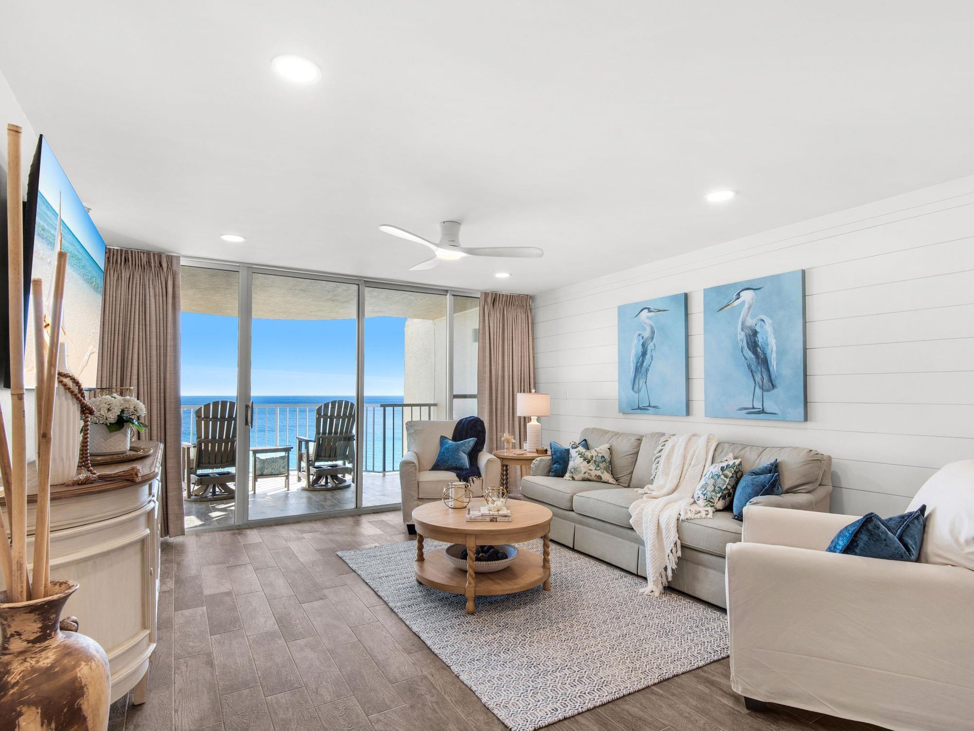 Relax in your bright living room with stunning ocean views through floortoceiling windows opening to your private balcony.