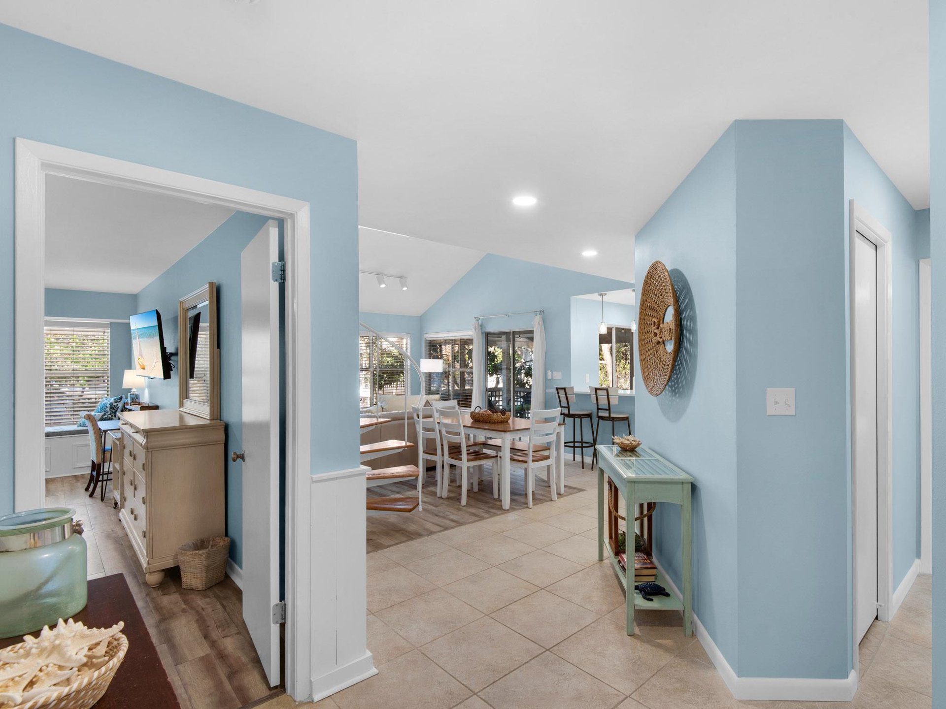 Relax in your coastalinspired retreat with soft blue walls and open living spaces that flow beautifully together.