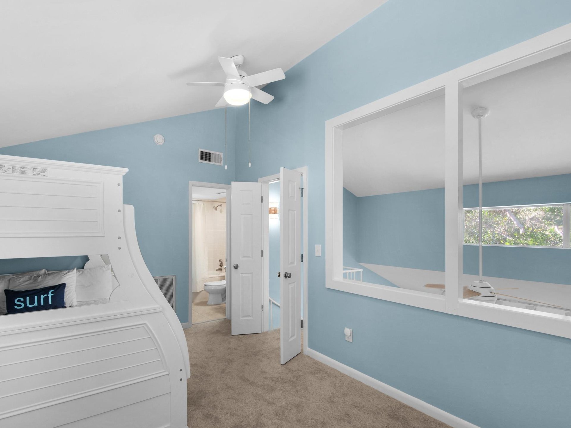 Sink into coastal comfort in this oceaninspired bedroom with builtin bunks and peaceful blues that invite sweet dreams.