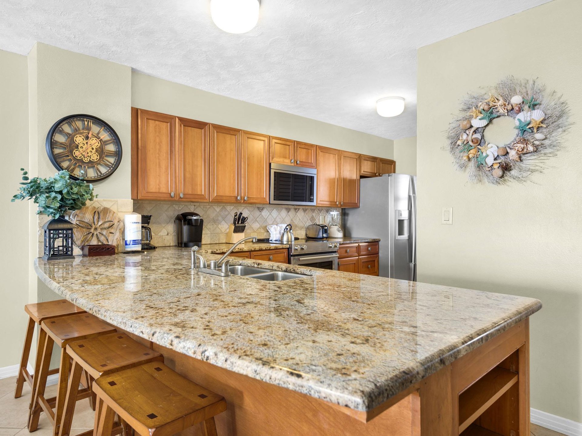 Your fullyequipped kitchen awaits with granite counters, stainless appliances, and breakfast bar seating for memorable vacation meals together.