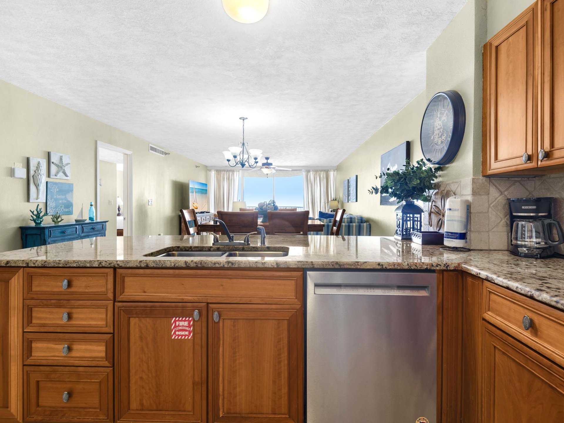 Your fullyequipped kitchen features granite counters, modern appliances, and seamlessly flows into the comfortable living space.