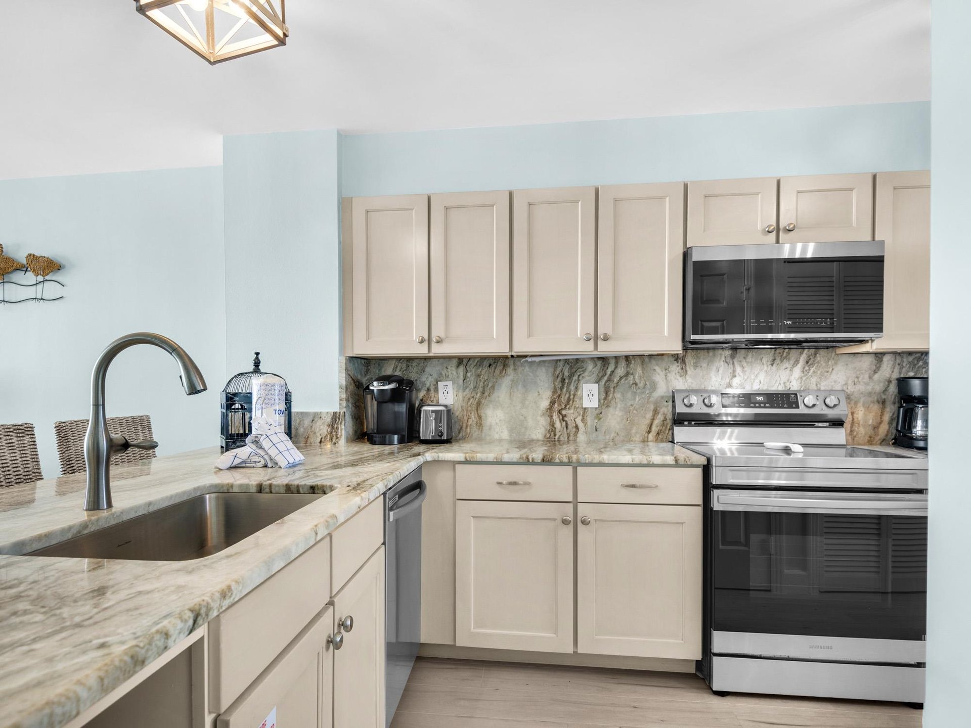 Your fully equipped kitchen awaits with granite countertops, stainless appliances, and everything needed for homecooked meals during your stay.