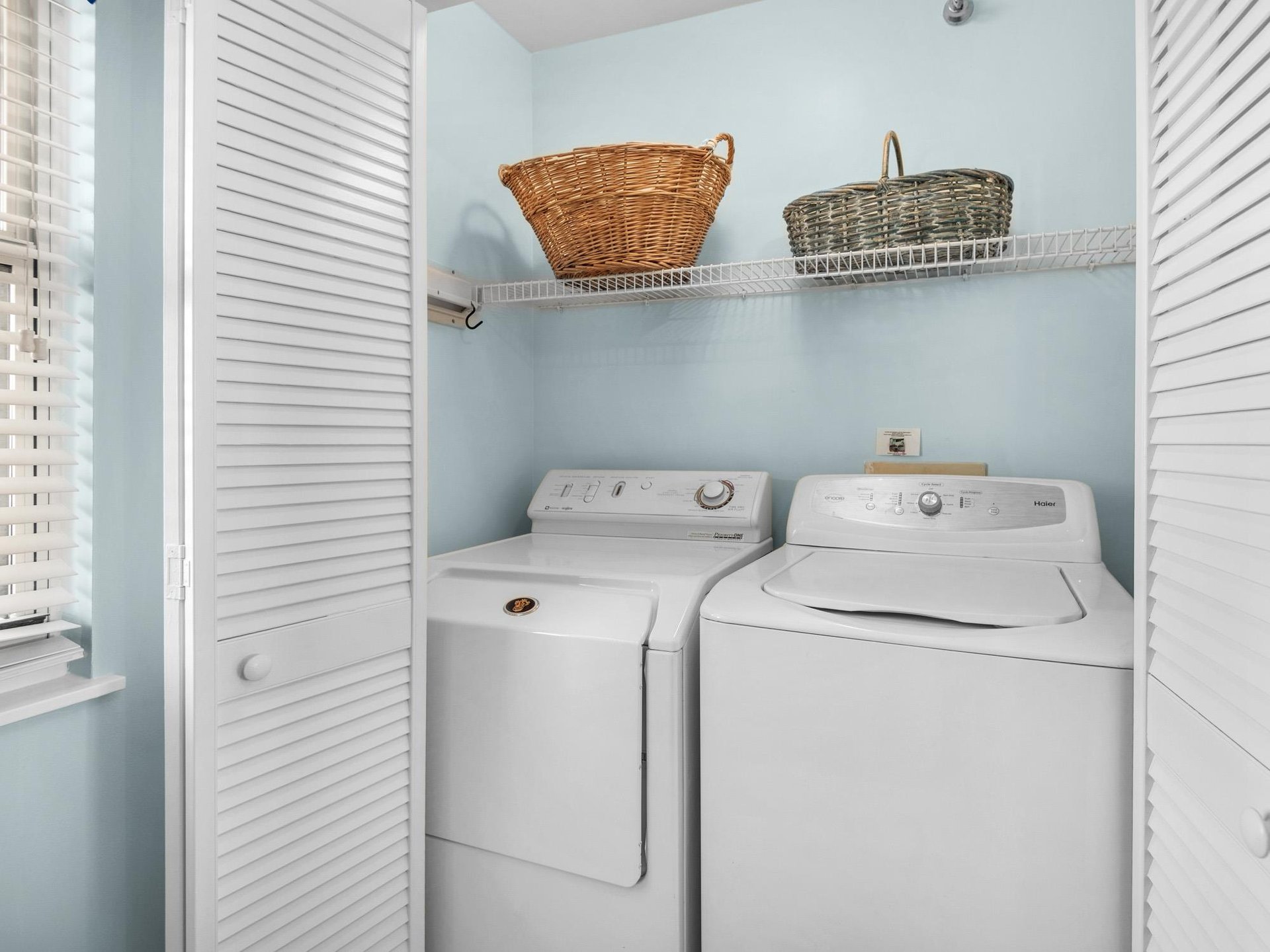 Your private laundry room with fullsize washer and dryer makes longer stays effortless, complete with storage baskets for your convenience.