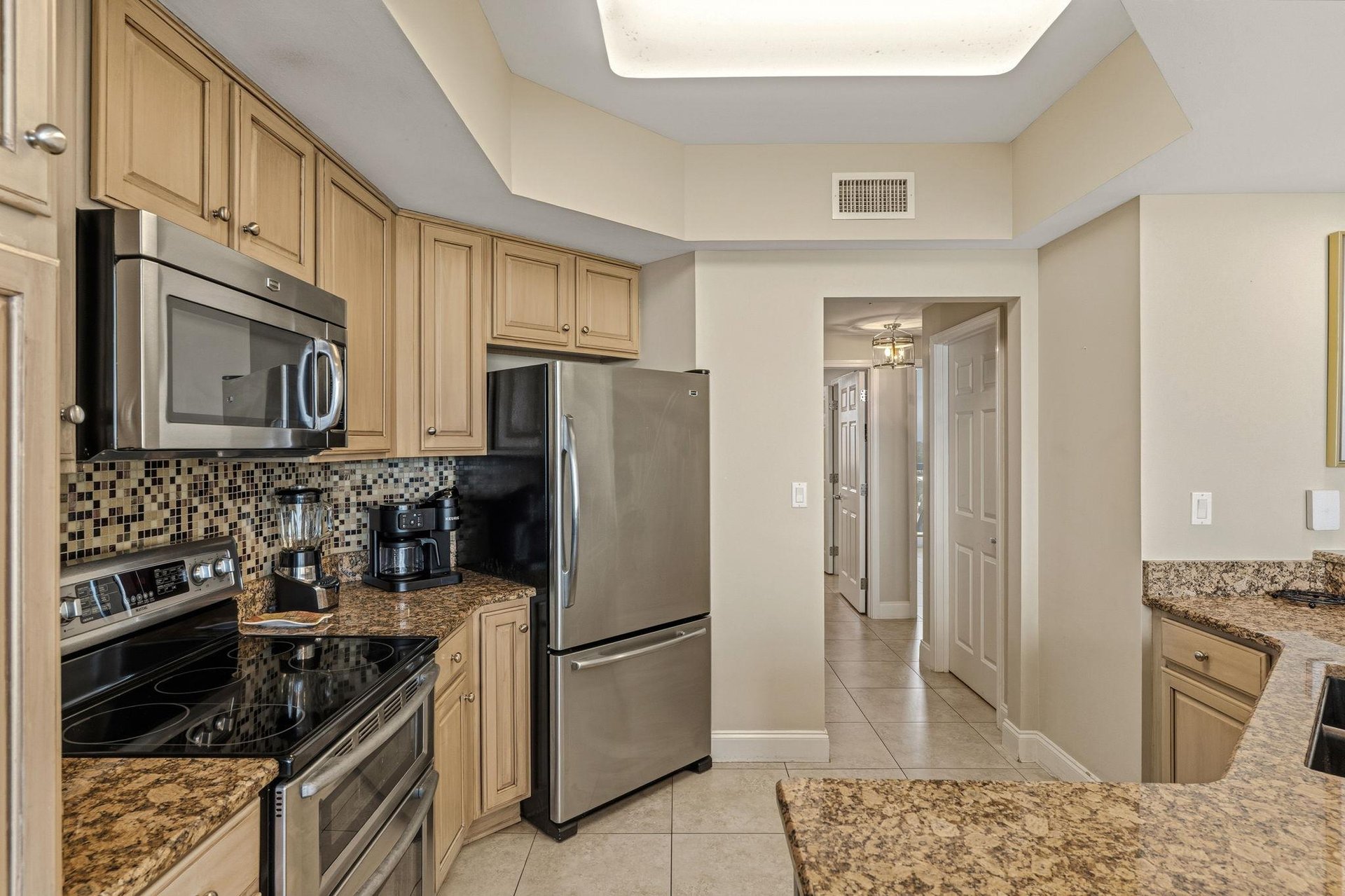 Your fullyequipped kitchen features granite countertops, stainless steel appliances, and everything you need to prepare delicious meals during your stay.
