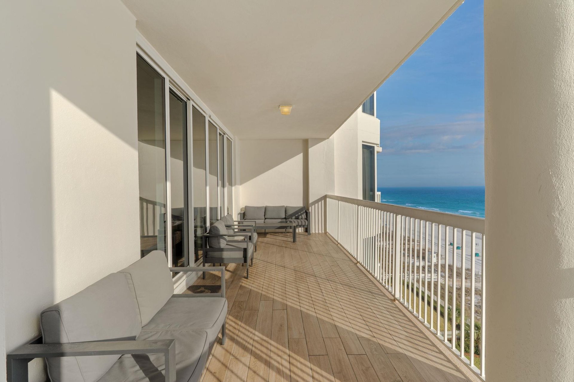 Step onto your private oceanfront balcony where comfortable seating awaits and endless sea views stretch to the horizon.