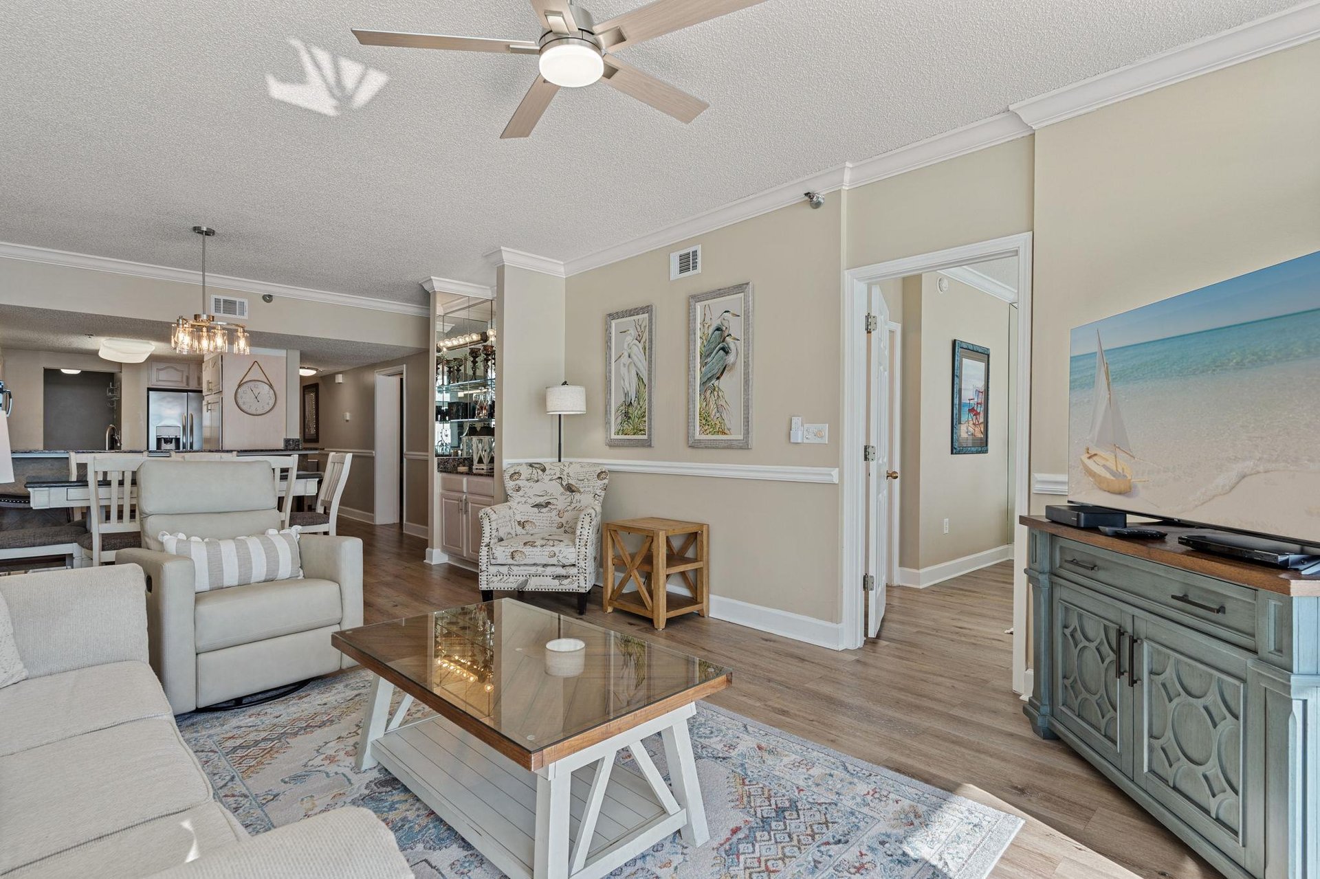 Living space featuring comfortable seating and coastal decor.