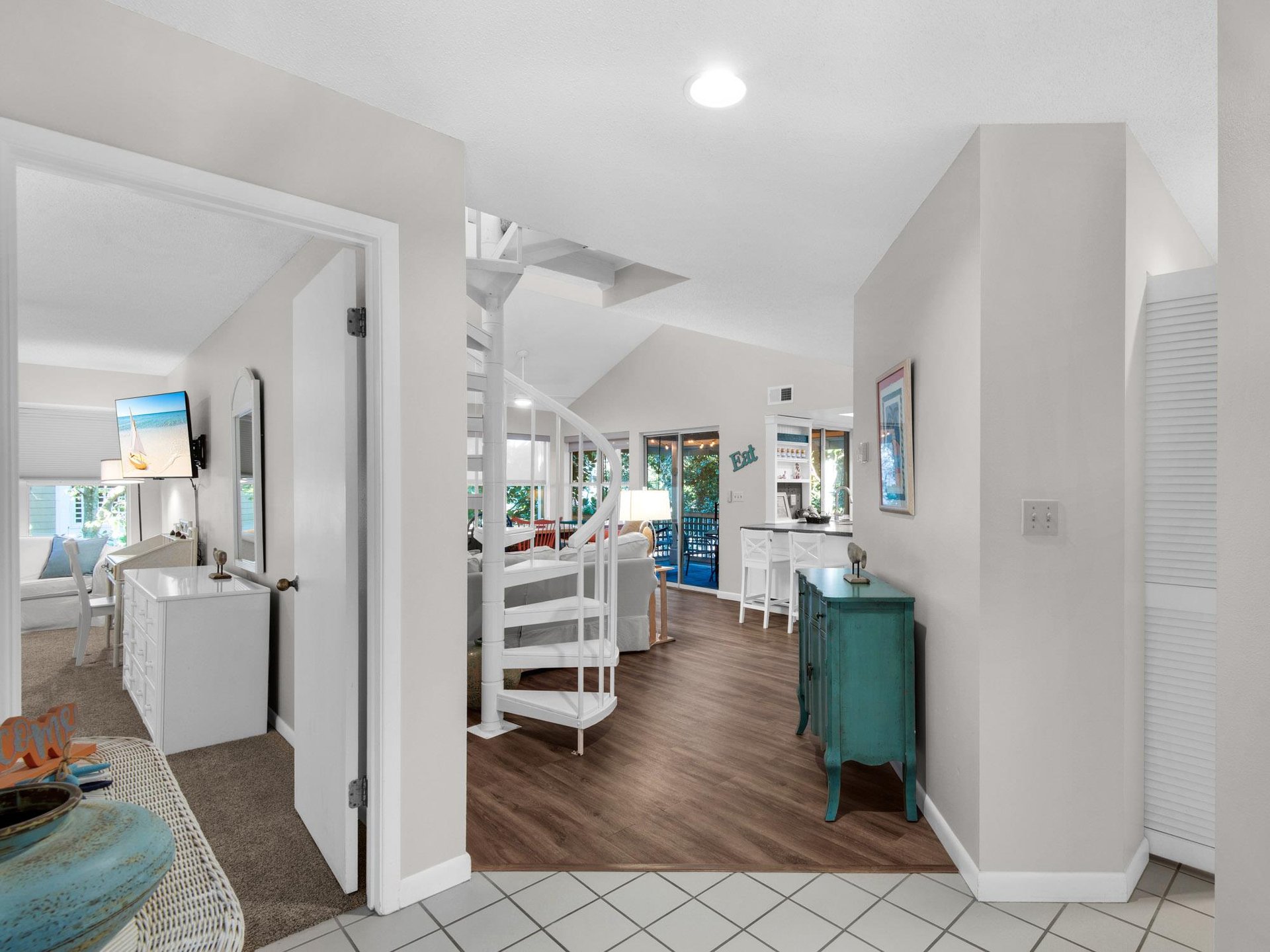 Step into your bright, openconcept retreat where coastal charm meets modern comfort through airy spaces and cheerful turquoise accents.