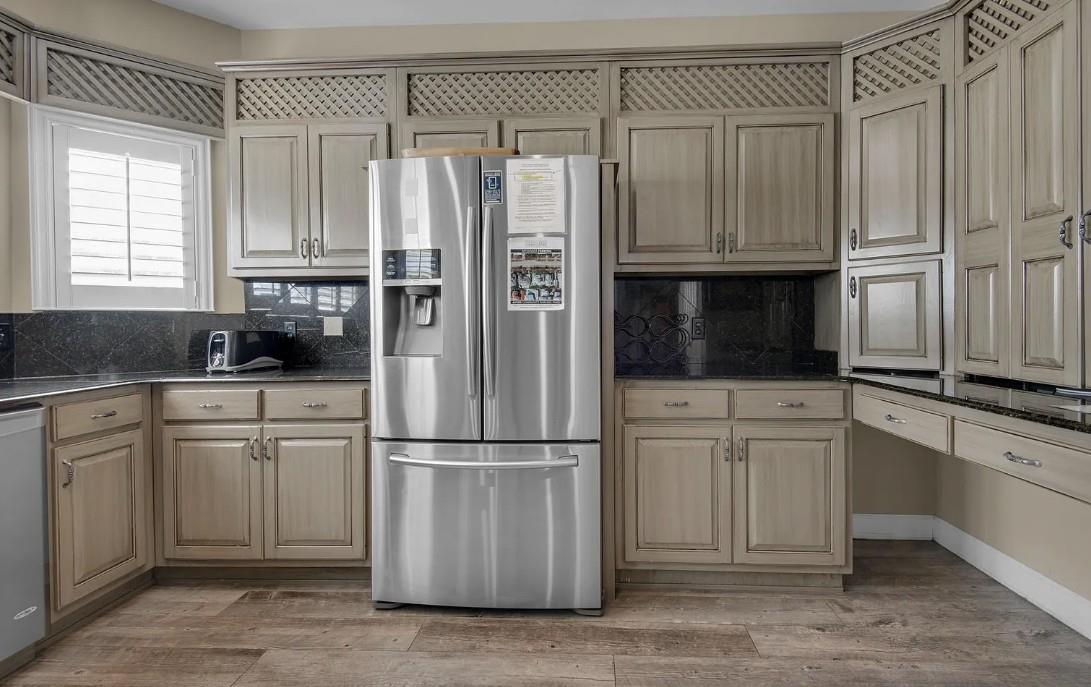 Your fully equipped kitchen awaits with stainless steel appliances, elegant cabinetry, and granite countertops perfect for preparing memorable meals during your stay.