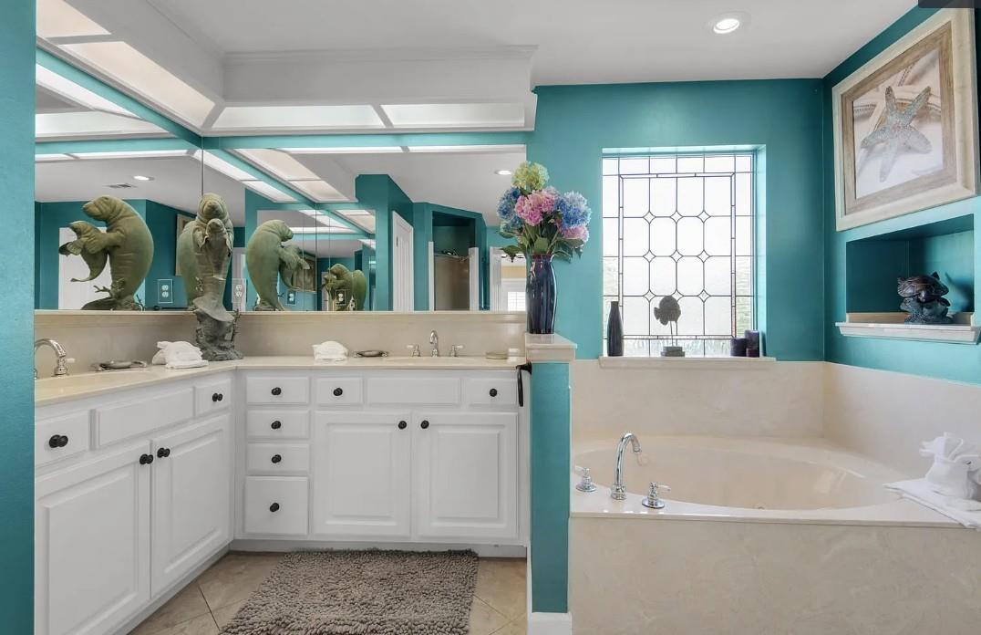 Bathroom 1 Unwind in your luxurious primary bathroom featuring granite countertops, deep soaking tub, and elegant finishes for ultimate relaxation.
