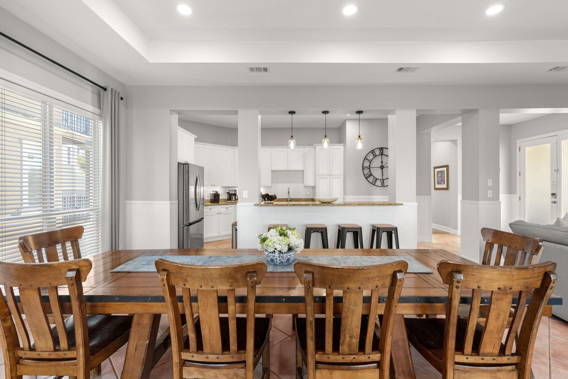 Gather around this stunning dining table where memorable meals and conversations await