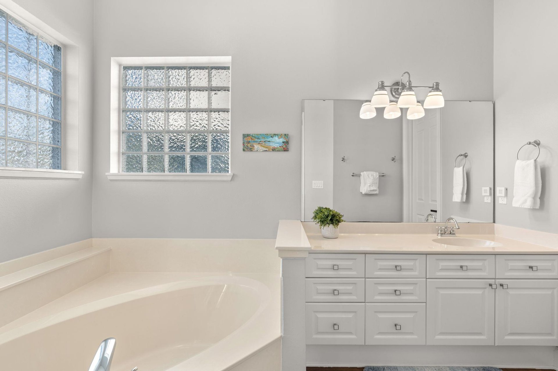 Bathroom 1 with Double Vanities and Natural Lighting