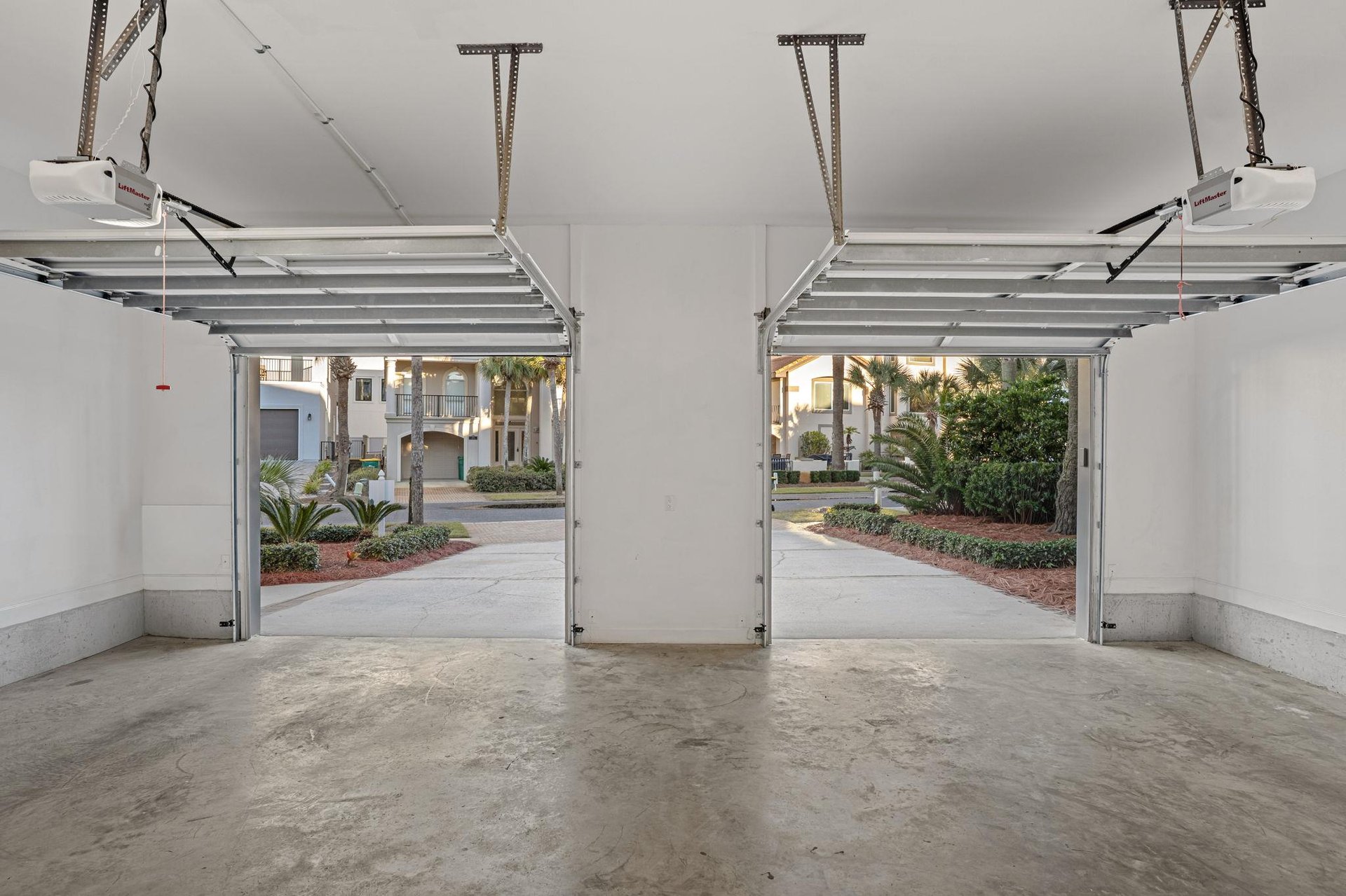 Private twocar garage offers secure parking with convenient automatic doors opening to beautiful landscaped grounds.