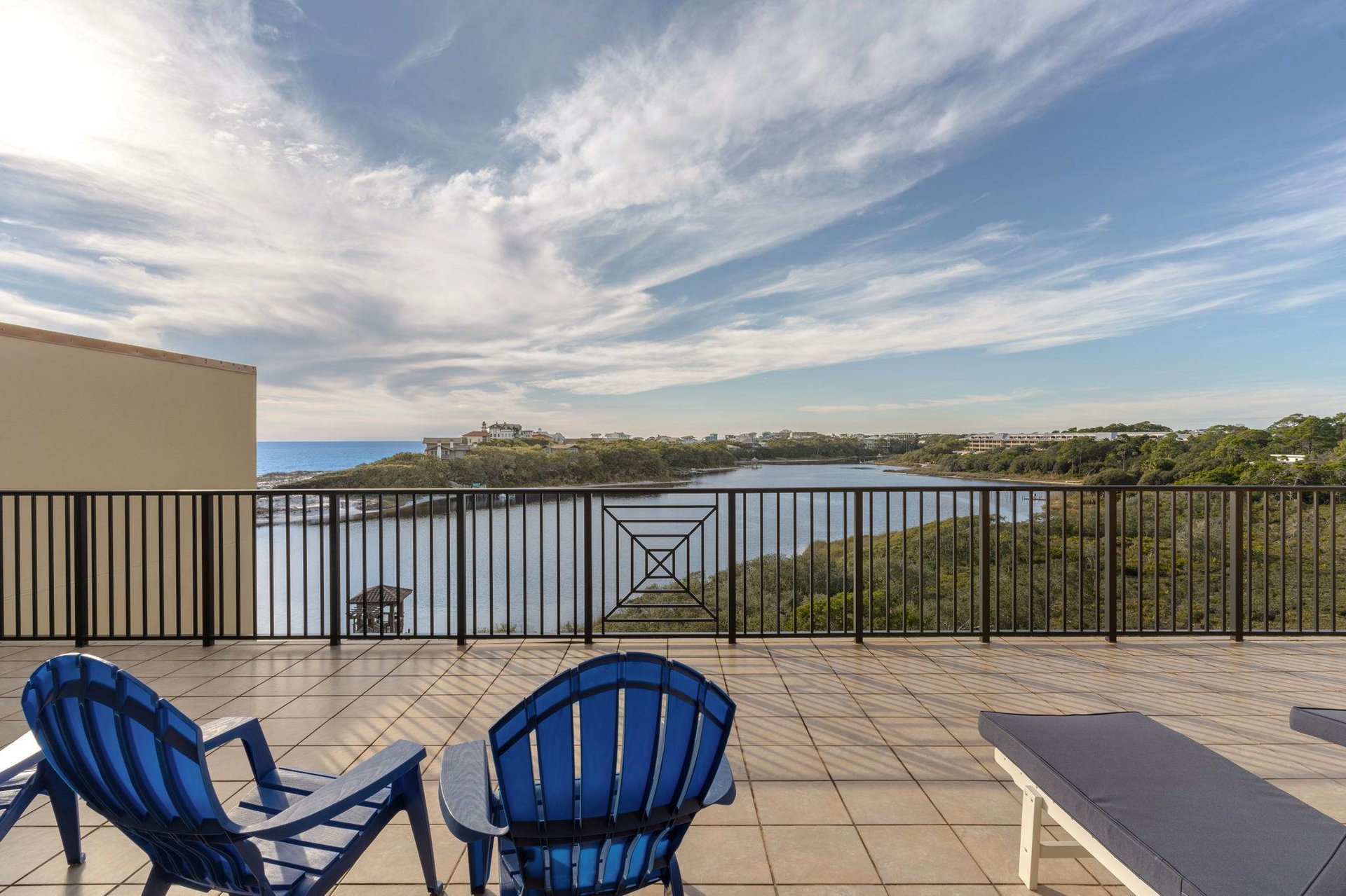 Unwind on your private terrace with stunning gulf and lake views and comfortable seating for peaceful mornings and sunset evenings.