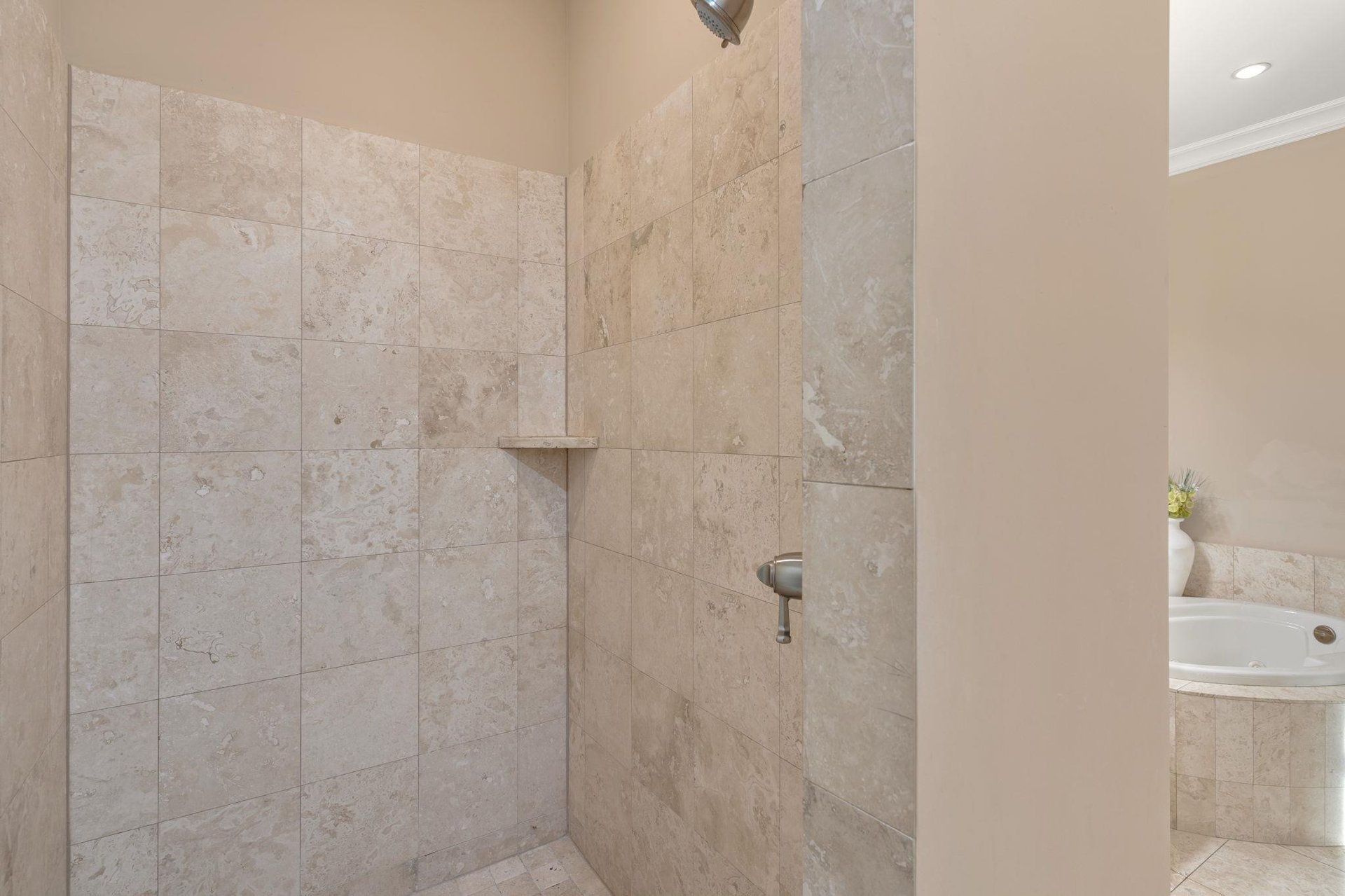 Luxurious marbletiled shower awaits your daily refresh, with spacious design and elegant stone finishes creating your personal spa retreat.