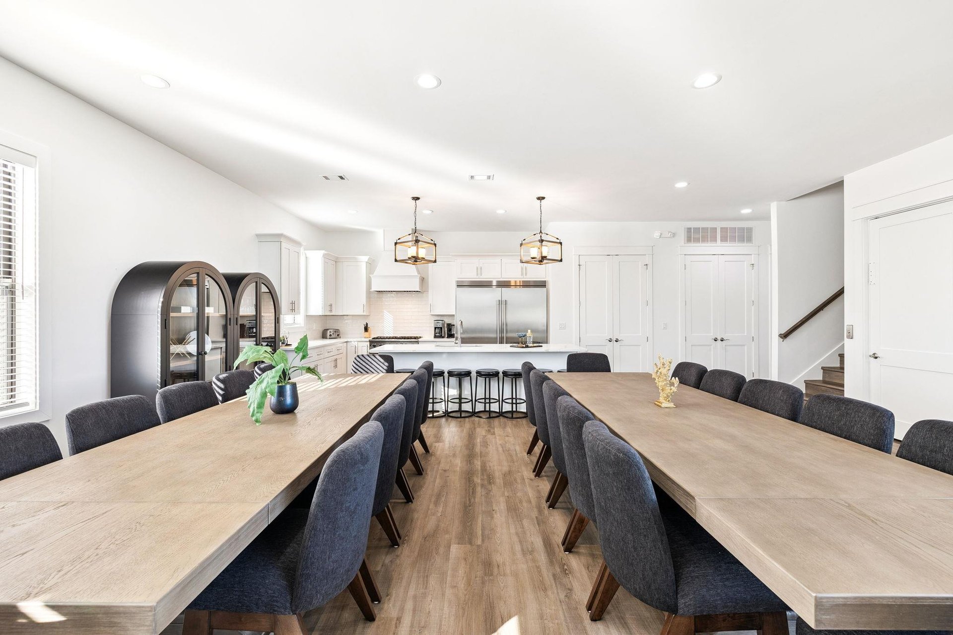 Gather around these stunning dining table where your group can share memorable meals together, with the gourmet kitchen just steps away for easy entertaining.