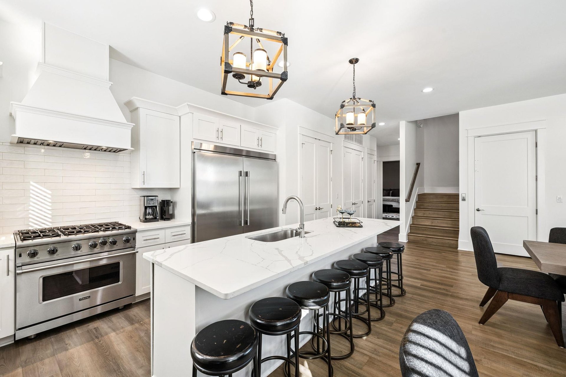 The fully equipped gourmet kitchen features marble countertops, professional appliances, and the core memories your family will make