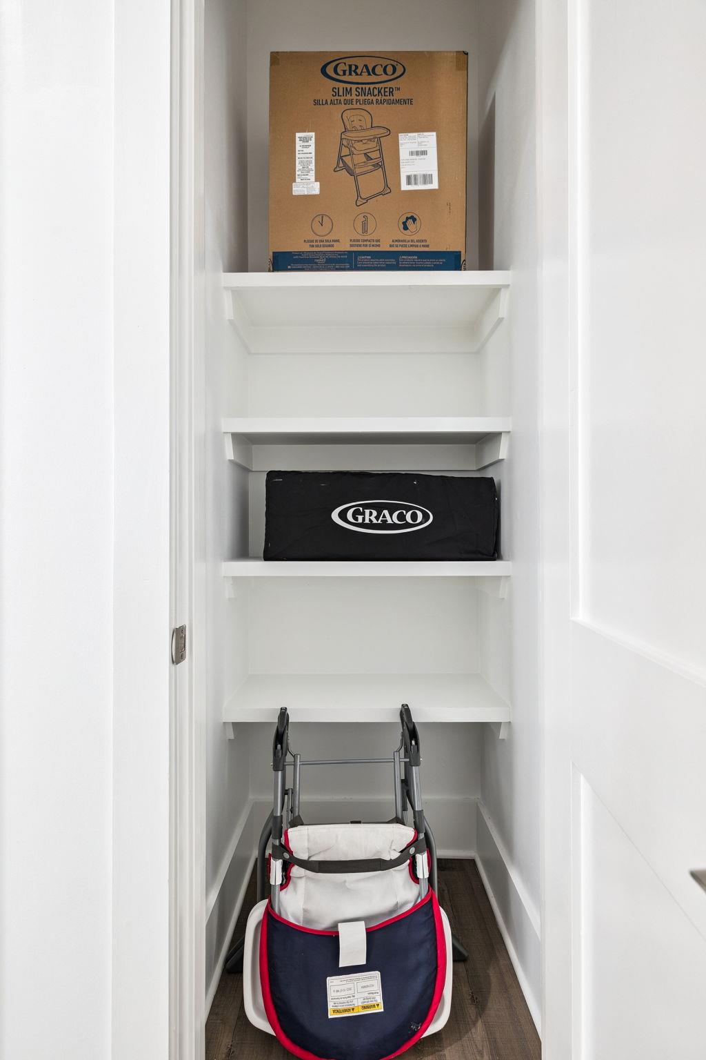 The organized storage closet keeps baby essentials neatly arranged and ready when you need them.