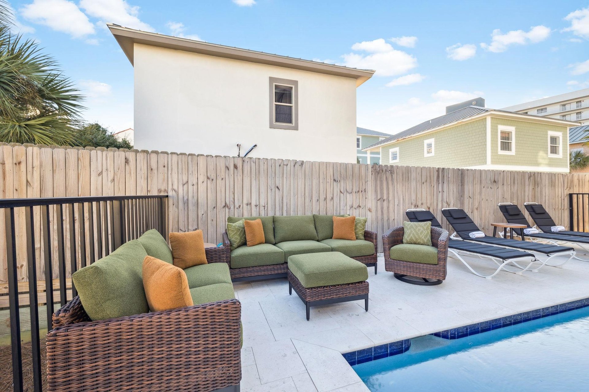 Relax in your private poolside oasis with plush seating and sun loungers for the perfect vacation retreat.