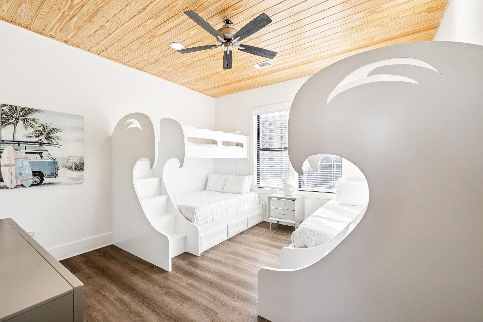 Step into your whimsical bedroom where cloudshaped bunk beds and warm wood ceilings create a dreamy escape for unforgettable nights.