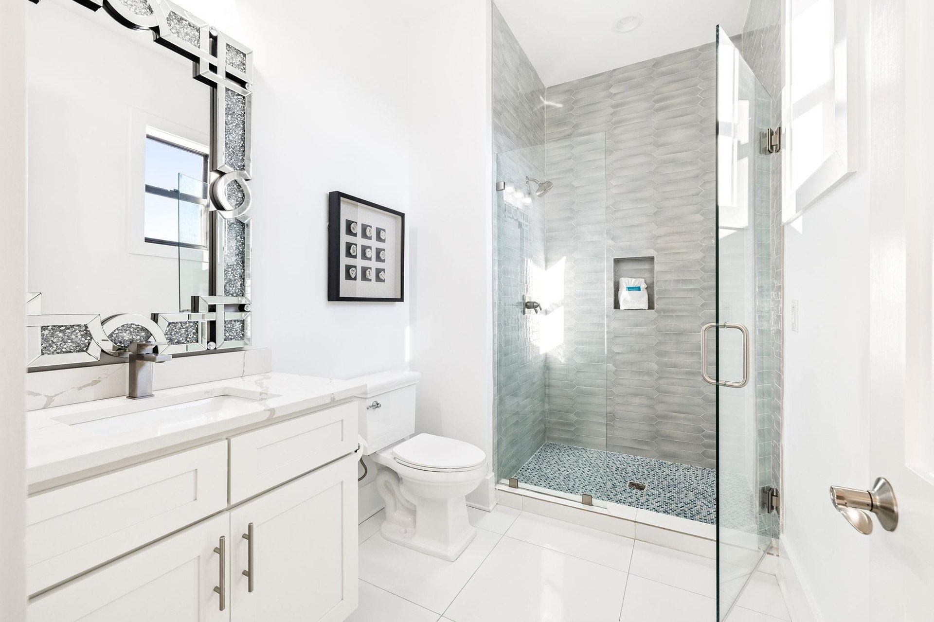 Step into your spalike bathroom featuring elegant marble finishes and a luxurious glassenclosed shower for your ultimate relaxation.