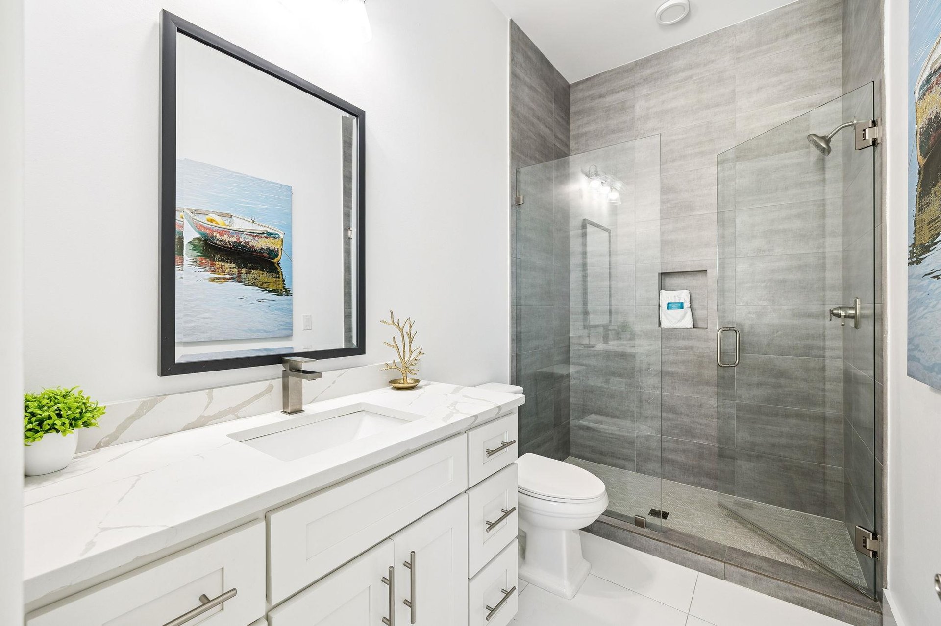Step into your spalike bathroom with marble counters, glass shower, and elegant finishes for your perfect morning routine.