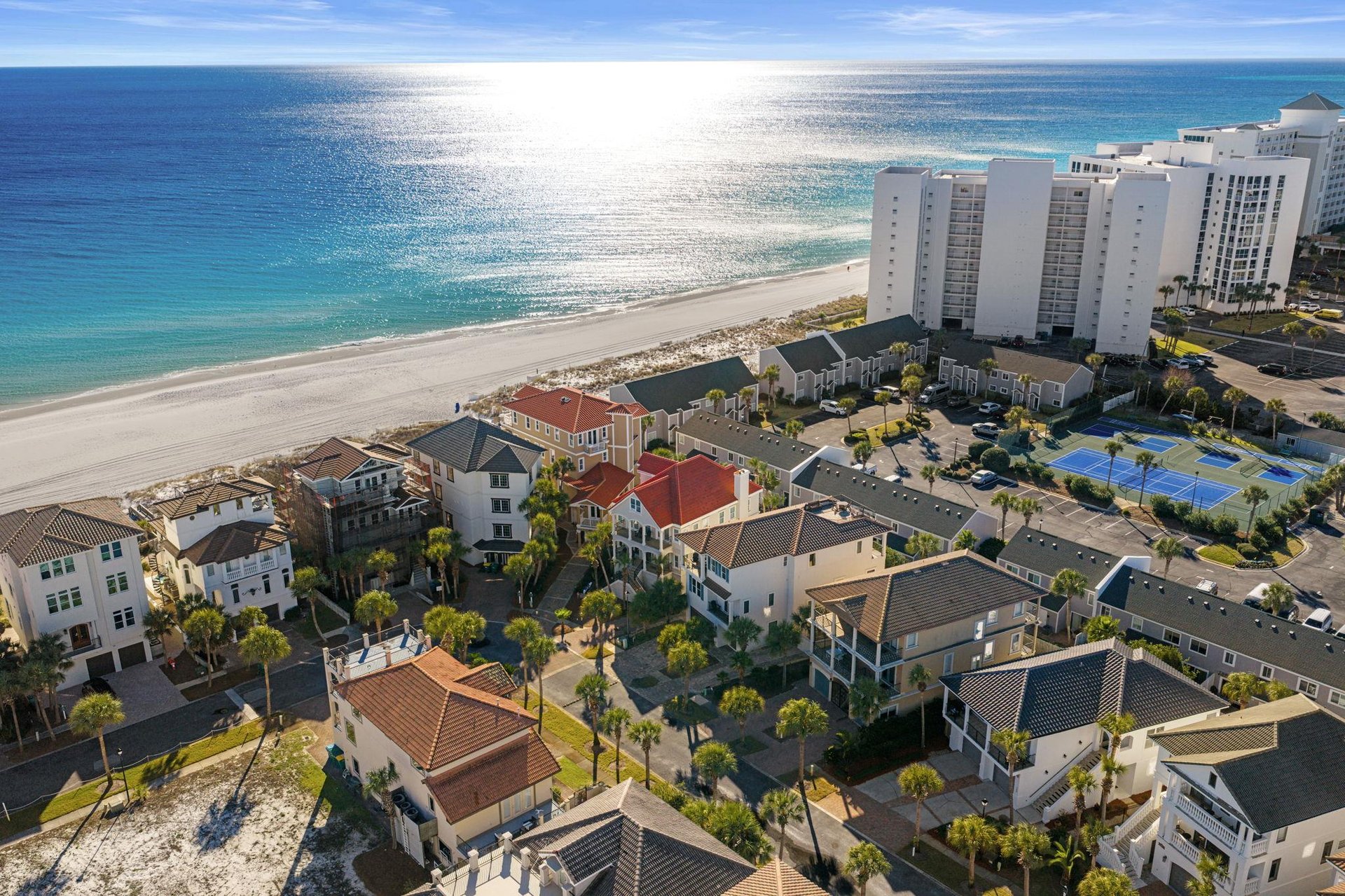 Stunning beachfront location with pristine white sand and crystalclear waters just steps from these coastal vacation homes.